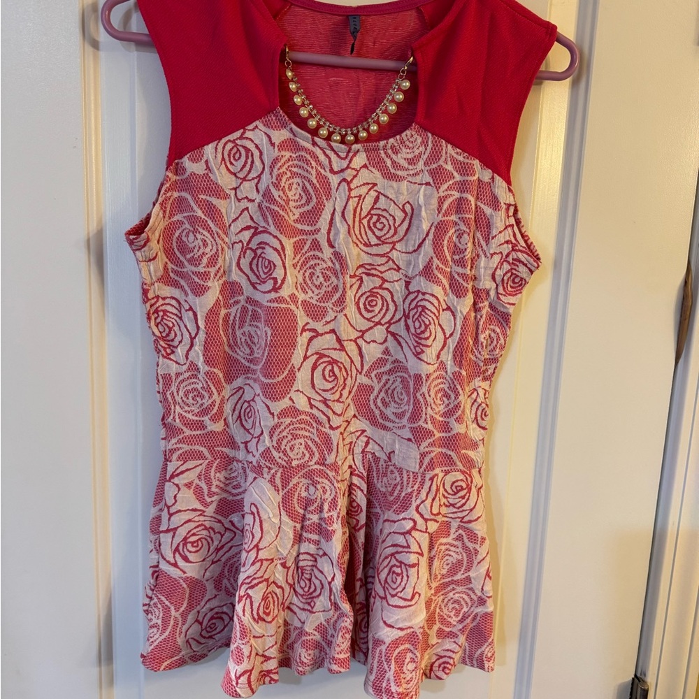 Pink Sleeveless Peplum Blouse